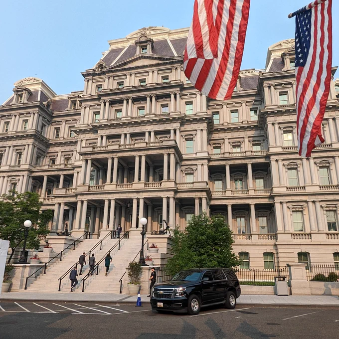 The Eisenhower Executive Office Building, with flags in the foreground