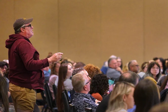 Attendee James Schuler asking a question