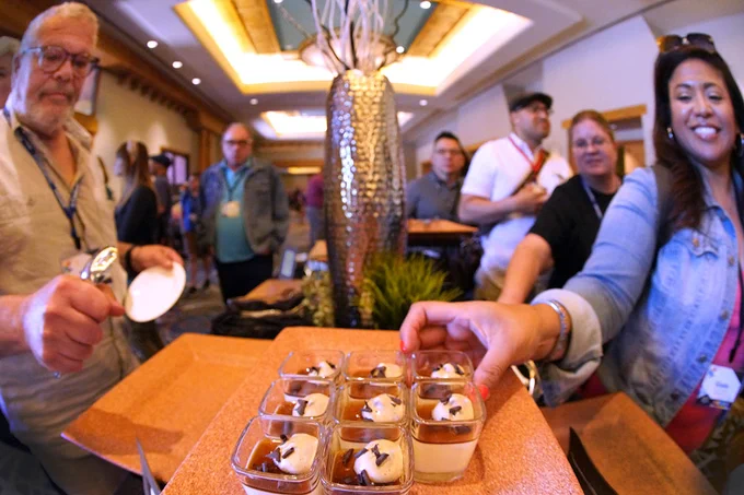 Attendees enjoying an afternoon snack