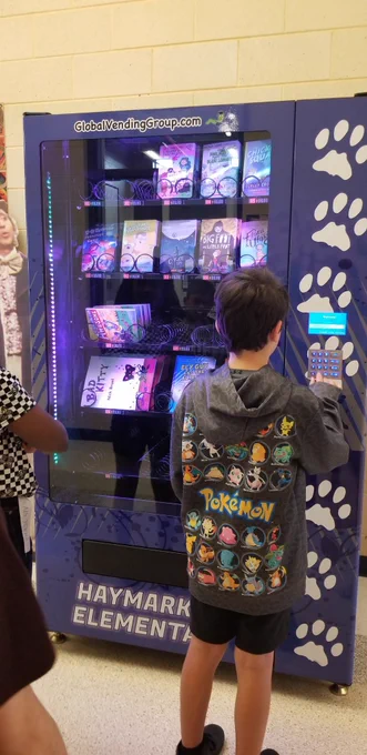 Boy pressing buttons on vending machine