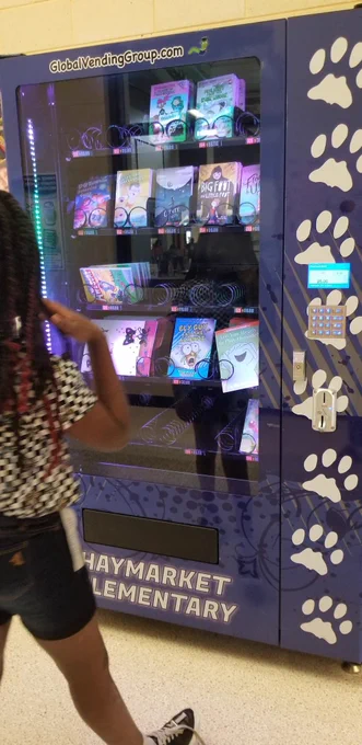Girl looking at vending machine 