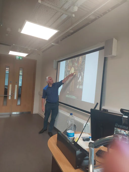 Fred pointing towards something on his slides for delegates