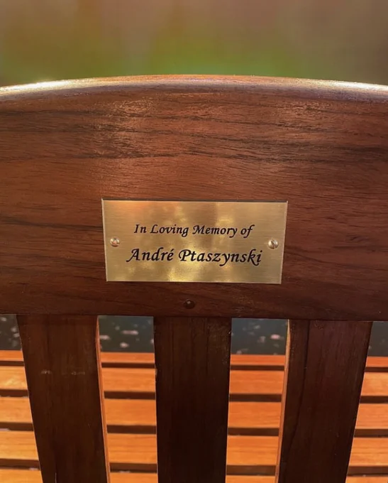 Close up of the plaque which reads "In Loving Memory of André Ptaszynski".