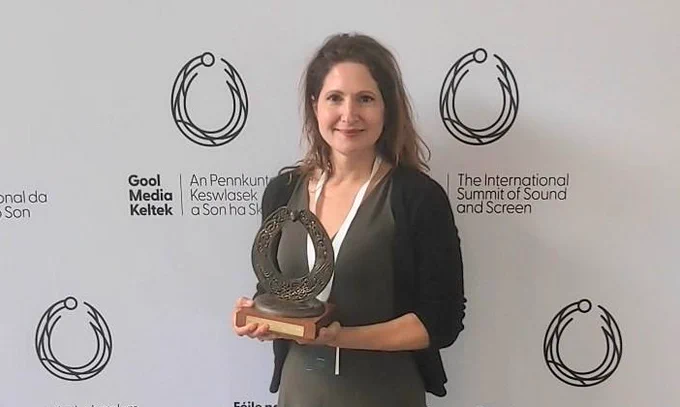 Naomi Spiro with Torc Award in hand.