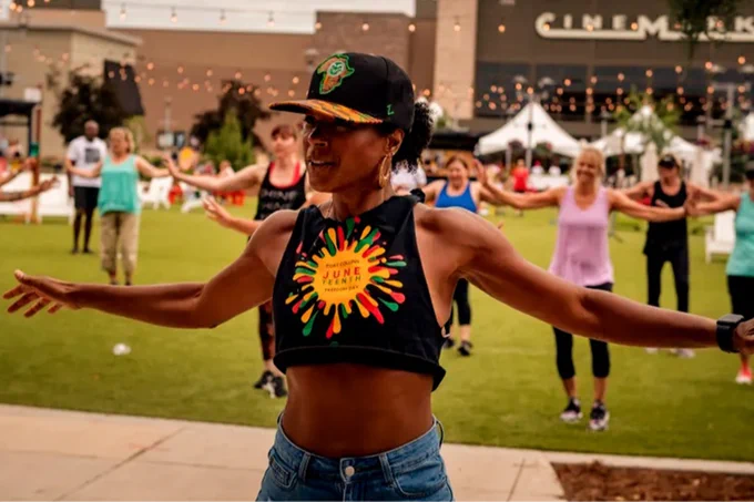 Dr. Michelle Foster leads a group exercise outside of the Foothills Mall in Fort Collins, Colorado. 