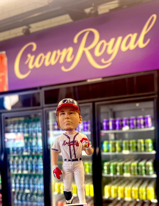 A Chipper Jones bobblehead is seen in front of the Crown Royal Walk-Off Market at Truist Park.