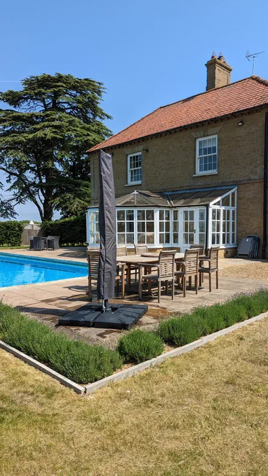 Country house, swimming pool, blue sky 
