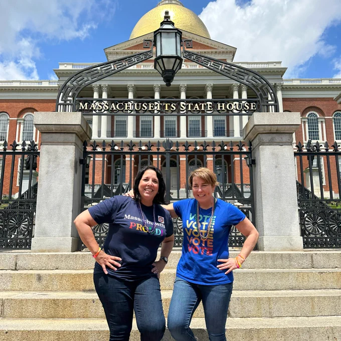Photo of Gov. Healey and L.G. Driscoll standing in front of the Massachusetts State Capitol