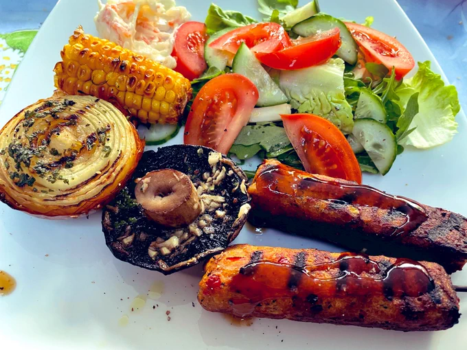 Vegan bbq: M&S vegan kebabs, garlic mushrooms, corn on the cob, mixed salad, roasted onions and coleslaw