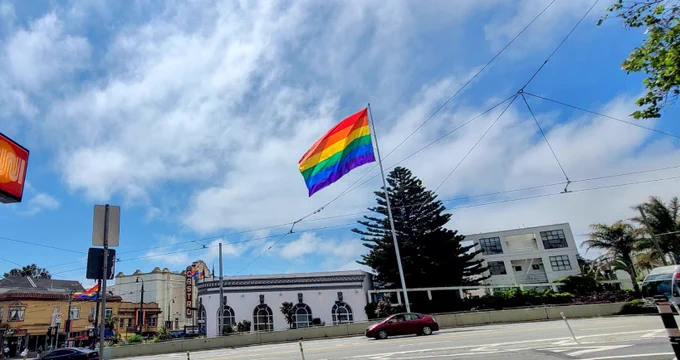 The rainbow pride flag flying above the Castro