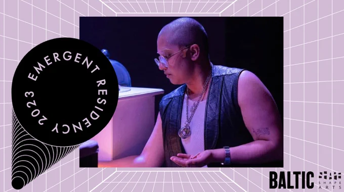 Photograph of Kasra - standing side on under purple light, leaning forward slightly, holding a small object in one hand. They wear glasses and a leather waistcoat over a tshirt. The photo is layered atop a lilac background with white grid lines and logos for the Emergent programme, Baltic and Shape Arts.