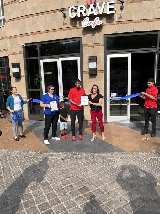 CM Stewart’s Chief of staff @DCCecily and @gsscc CEO Stephanie Helsig help open Crave Cafe. Pictured with Milton  Colguehoun, owner of Crave Cafe and his son!