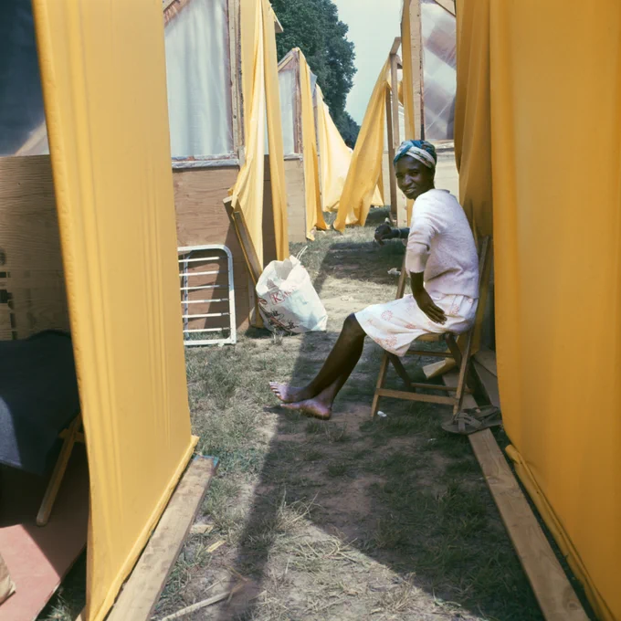 Woman between tents, Resurrection City, Washington, D.C., 1968. Robert Houston, born 1935. Smithsonian’s National Museum of African American History and Culture, Gift of Robert and Greta Houston, © Robert Houston.