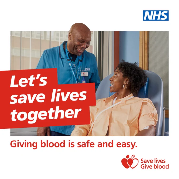 A woman donating blood with a donor carer standing next to her. Text overlay on the image reads: Let's save lives together. Text on the bottom of the image reads: Giving blood is safe and easy. The NHS logo is at the top on the right and the Give Blood logo is at the bottom on the right. The give blood logo reads: Save lives, give blood.