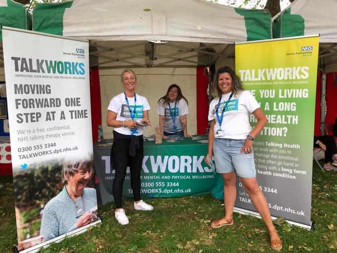 Three TALKWORKS therapists are pictured at Exeter Respect Festival