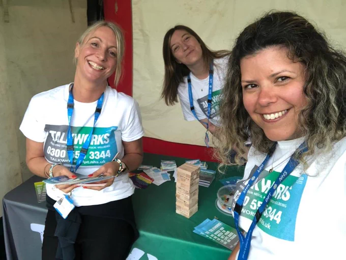 Three TALKWORKS therapists are pictured at Exeter Respect Festival