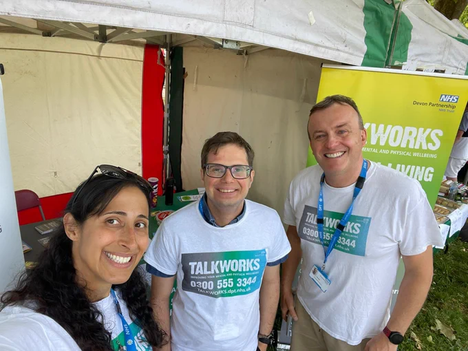 Three TALKWORKS therapists are pictured at Exeter Respect Festival