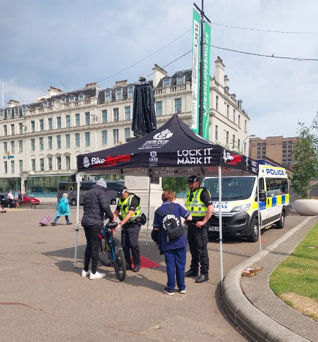 Officers talking to members of the public in George Square, Glasgow.