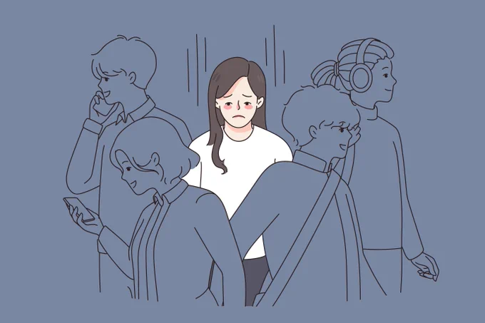 The image shows a cartoon with a person in white in the middle looking sad- other people are around but they are outlined and in a different colour. Loneliness awareness.
