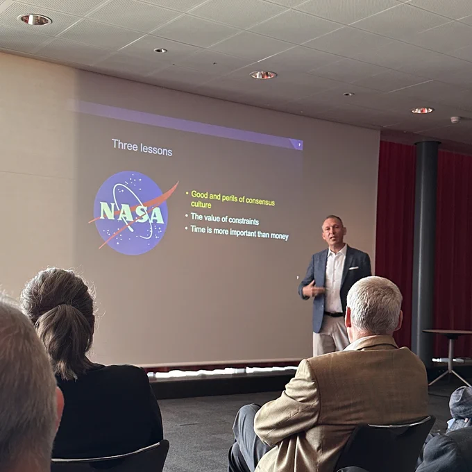 Thomas Zurbuchen presenting three lessons he learned at NASA: Good and perils of consensus culture, the value of constraints and time is more important than money.
