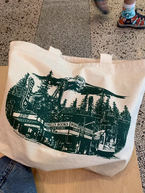 reusable tote bag with powell’s books printed on it