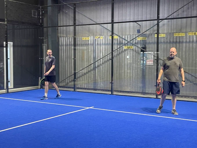 Two men playing padel