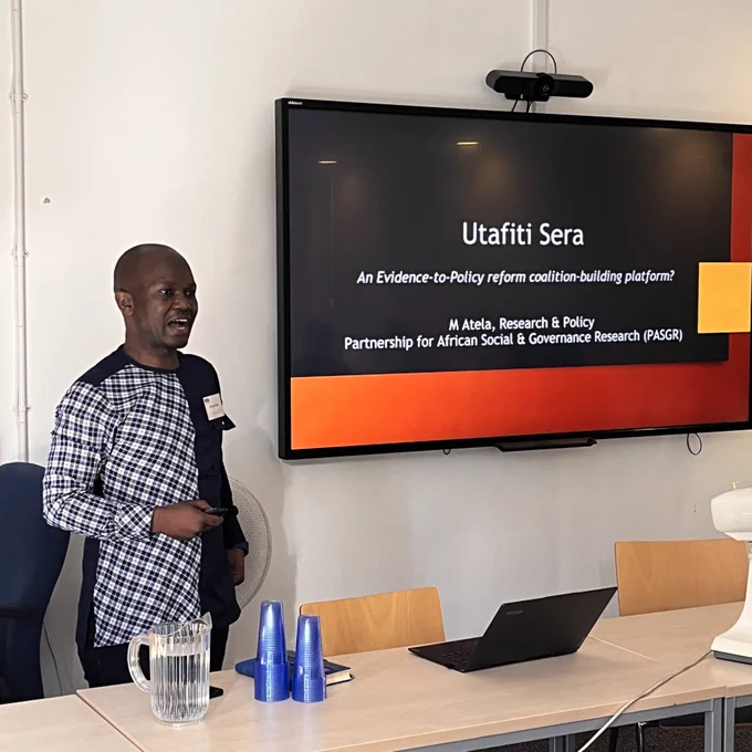 Image of Martin Atela presenting.