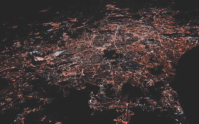 Satellite photo of North America at night with city lights and dark areas of countryside. 