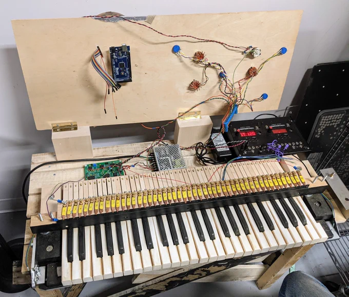 Reconstruction of the Electronic Sackbut synthesizer with top control surface open revealing electronic components and circuitry underneath.