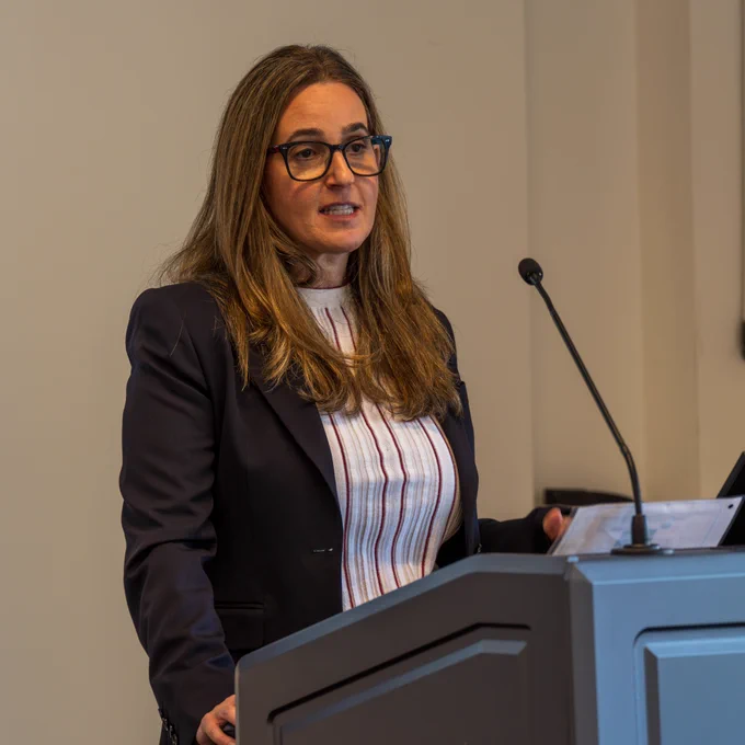 Dr. Victoria Kirsh at the podium
