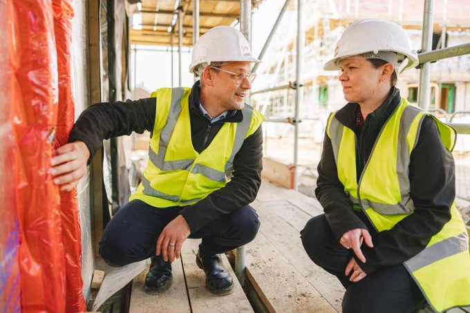 Building Control surveyors checking building regulations for a new build home.
