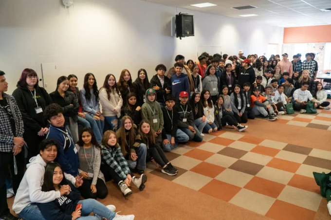The group of 100  Caminos students at a fall semester event.