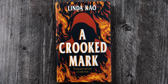 A flatlay photo of the book A Crooked Mark by Linda Kao