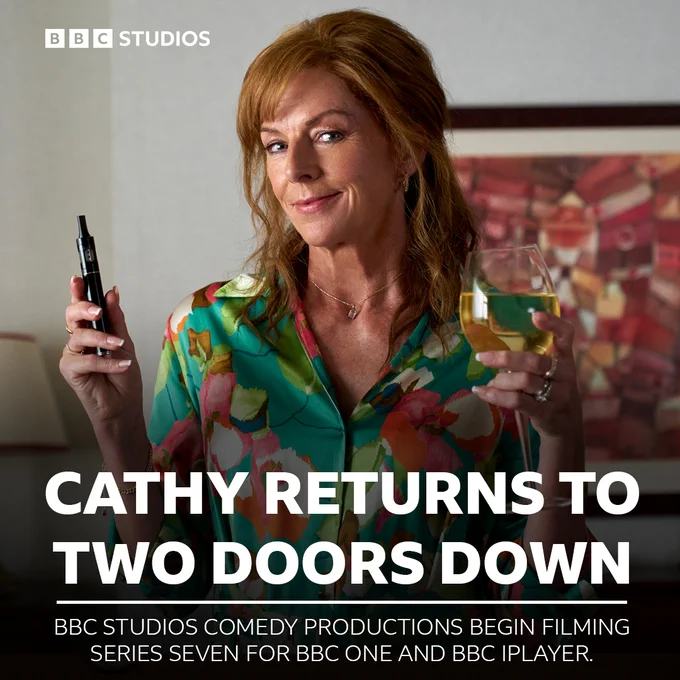 Composite image featuring an image of Doon Mackichan as Cathy in Two Doors Down series seven overlaid with the following text: “Cathy returns to Two Doors Down - BBC Studios Comedy Productions begin filming series seven for BBC One and BBC iPlayer.”