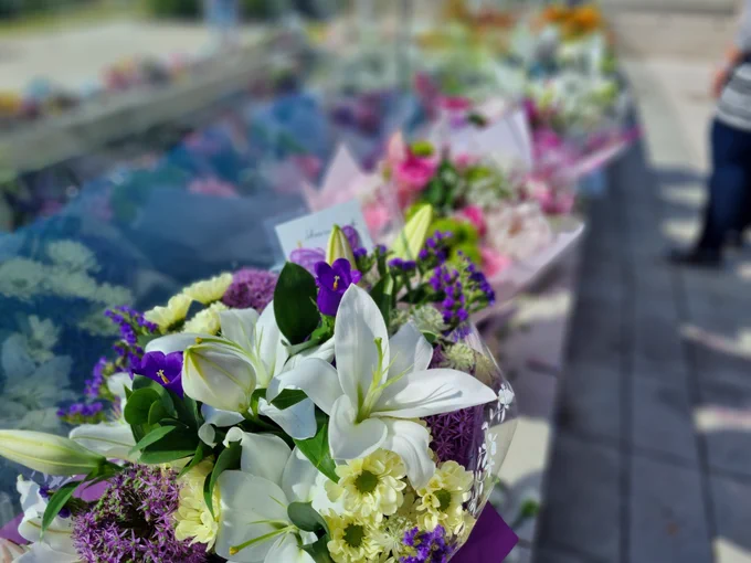 Flowers left on Djanogly Terrace at the University of Nottingham in remembrance for students Grace and Barney.
