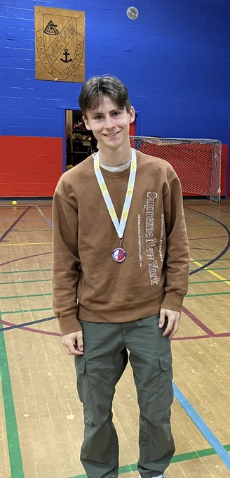 Sam R pictured with his Sportsmanship Medal.