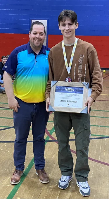 Sam pictured with Mr. Hackett and his Student Athlete of the Year Award.