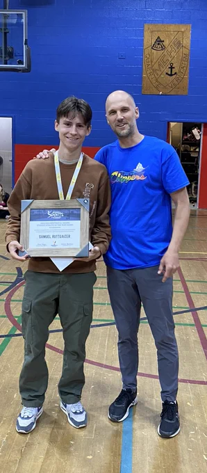 Sam pictured with Mr. Brushett and the Student Athlete of the Year Award.