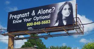 Billboard of an anti-abortion crisis pregnancy center