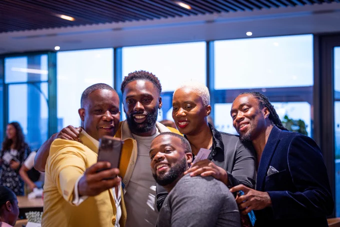 Attendees taking a selfie.