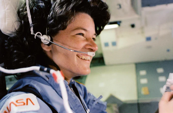 s07-31-1603 (June 24, 1983) --- NASA astronaut Sally K. Ride, STS-7 mission specialist, is seen sitting in the aft flight deck during deorbit preparations. Ride became the first American woman in space on June 18, 1983. Photo credit: NASA