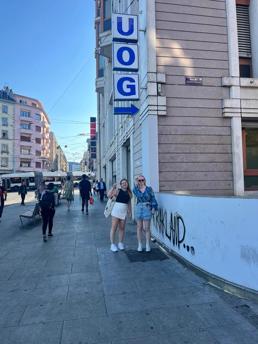 University of Gloucestershire students posing with a UOG sign in Geneva