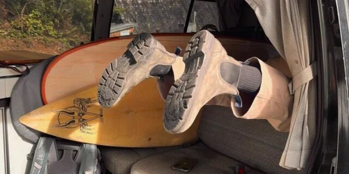 Blundstone Boots diving into a van.