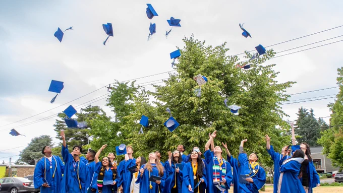 students throwing their caps at graduation