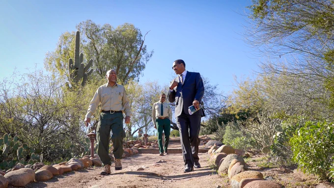 Randy Moore, Chief, UDA Forest Service (C) and Dr. Homer Wilkes, Under Secretary for Natural Resources and Environment, USDA (R) walk down a trail in the Tonto National Forest, Arizona, January 19, 2023. (USDA Forest Service photo by Preston Keres)