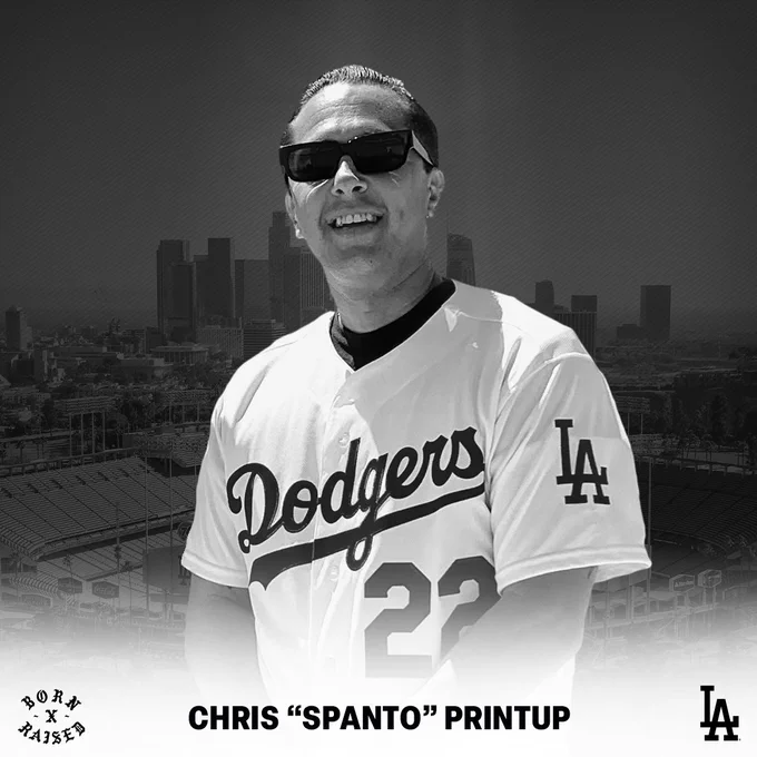 A photo of Chris "Spanto" Printup in a Dodgers Clayton Kershaw jersey. Behind him is a photo of the Dodger Stadium and DTLA.