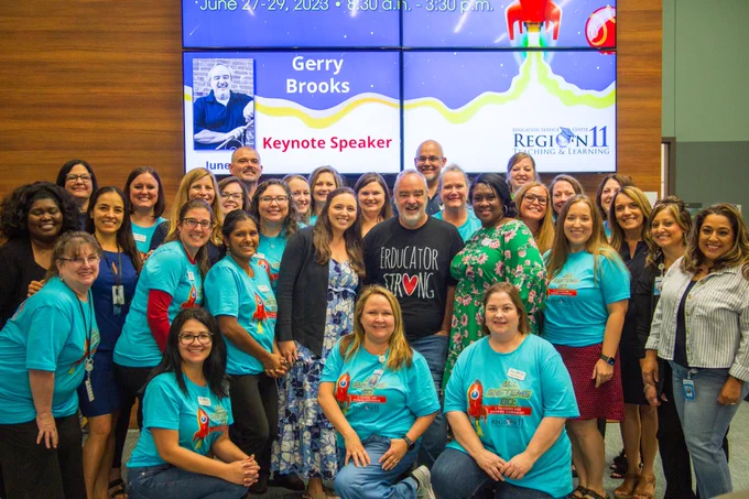 The Teaching and Learning Team pose for a group photo with Gerry Brooks.