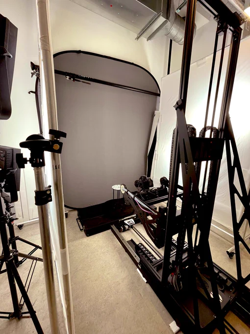 A photographic studio with a computer-controlled camera rig and lighting is set up in the basement of a customer’s premises.