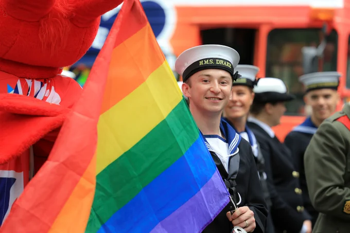 Royal Navy personnel with Pride flag