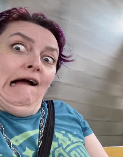 Me on the Teacups ride making exaggerated terror faces